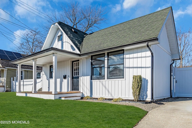 view of front facade with a front yard and a porch