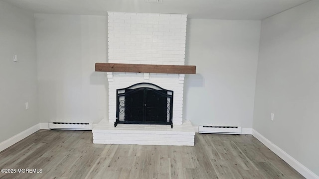 47 N Buckingham Dr, Manchester, NJ 08759 - unfurnished living room with a baseboard heating unit, baseboards, and wood finished floors