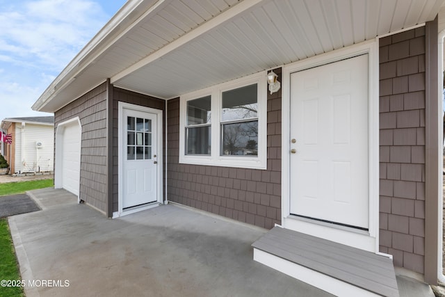 property entrance with a garage