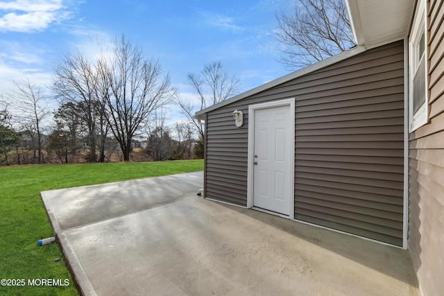 view of patio with an outbuilding