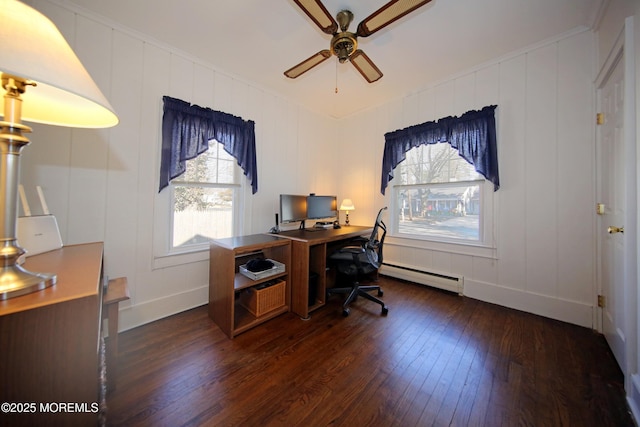 office area with a ceiling fan, baseboard heating, and dark wood finished floors