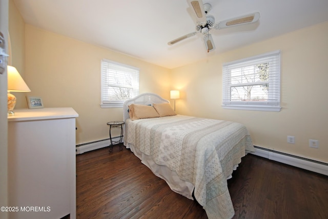 bedroom with ceiling fan, a baseboard radiator, and wood finished floors