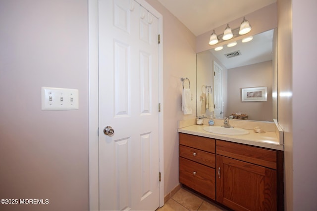 bathroom featuring tile patterned flooring, visible vents, and vanity