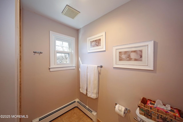 bathroom with toilet, baseboard heating, tile patterned flooring, and visible vents