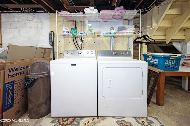 clothes washing area with laundry area and separate washer and dryer