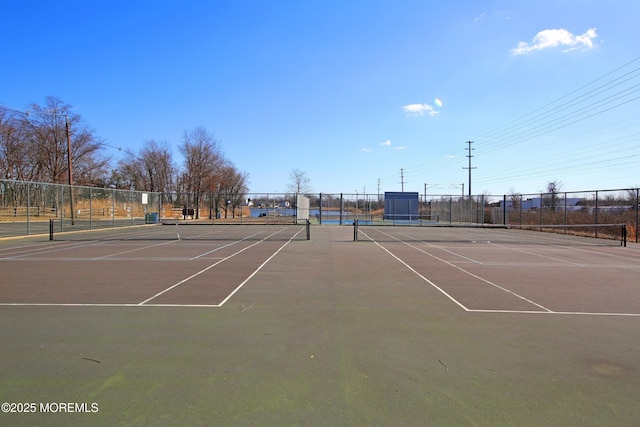 view of sport court with fence