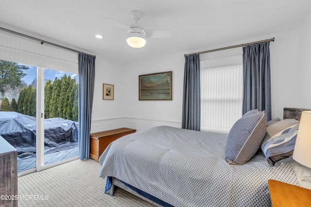 bedroom with ceiling fan and access to outside