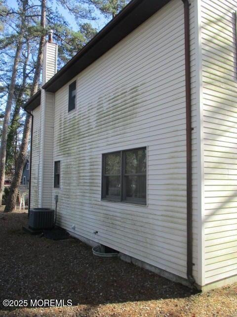 view of home's exterior featuring central air condition unit