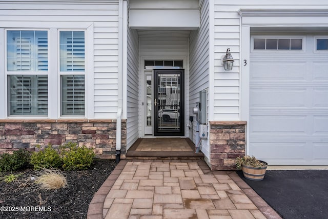 doorway to property featuring a garage