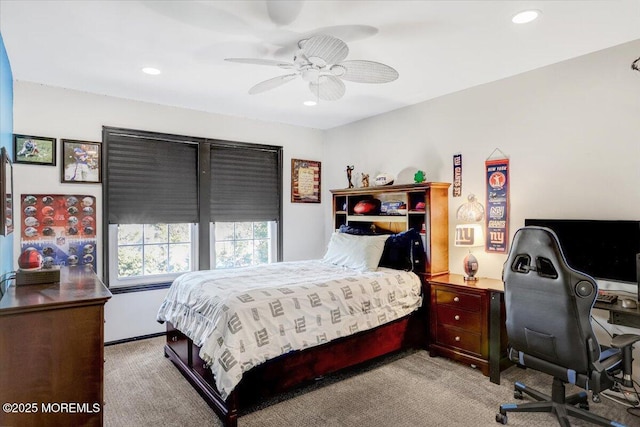 bedroom with light colored carpet and ceiling fan