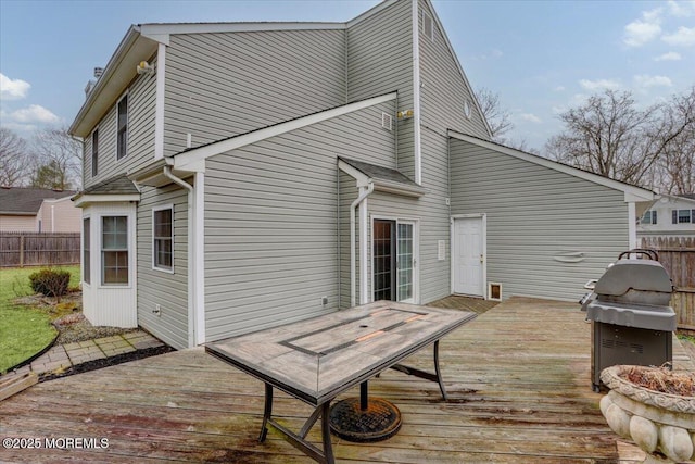 back of house featuring a deck