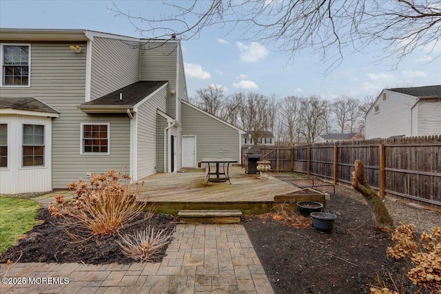 rear view of house with a wooden deck