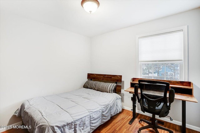 bedroom featuring wood-type flooring