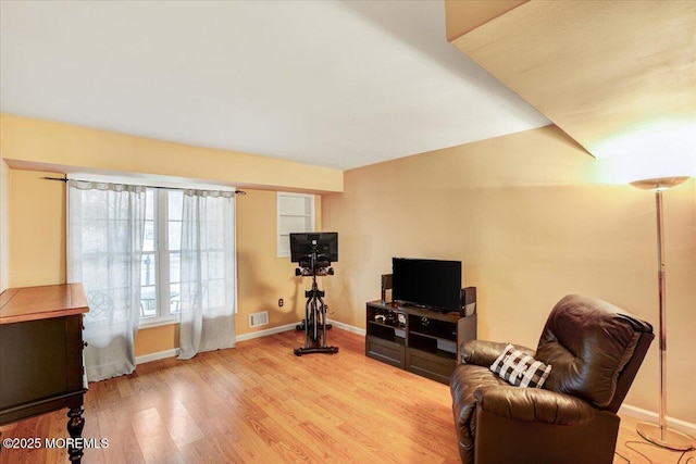 sitting room with light hardwood / wood-style floors