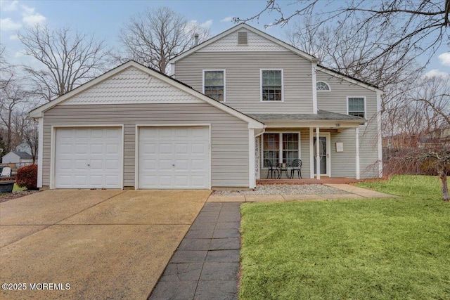 view of front property featuring covered porch, a garage, and a front yard