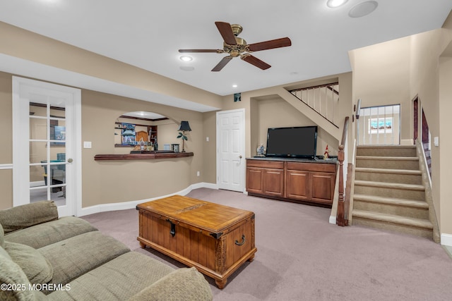 living room featuring stairs, recessed lighting, carpet, and baseboards