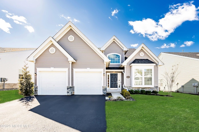 front facade featuring a front yard and a garage