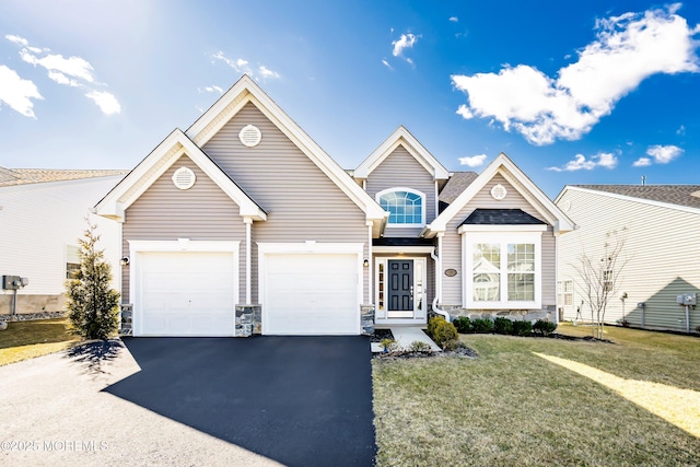 view of front property with a front yard and a garage