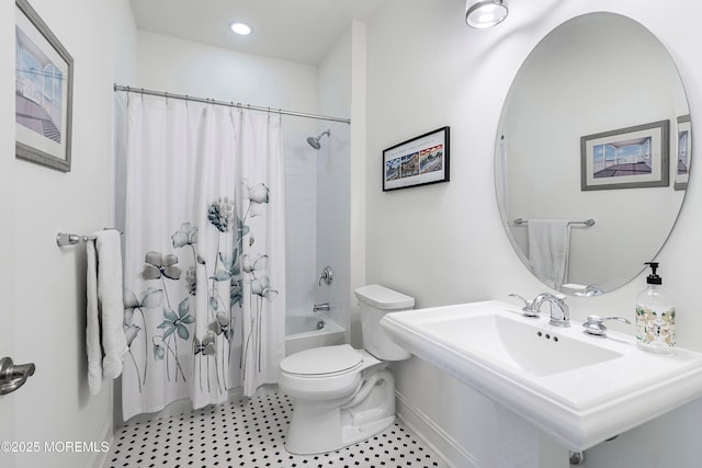 full bathroom with shower / bathtub combination with curtain, sink, and toilet