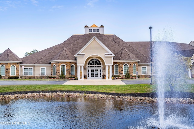 exterior space with a water view