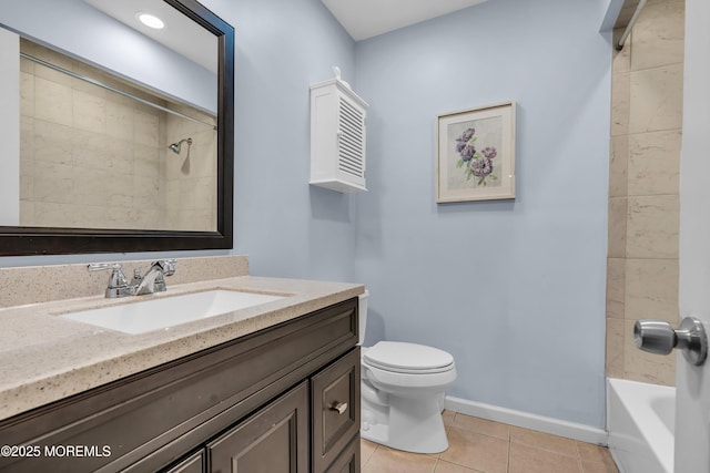 bathroom with tile patterned flooring, toilet, bathing tub / shower combination, vanity, and baseboards