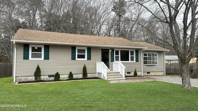 single story home with crawl space, a shingled roof, a front yard, and fence