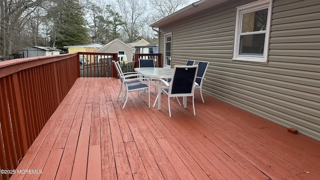 deck with outdoor dining space