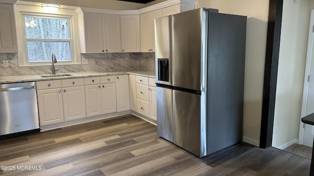 kitchen featuring a sink, dark wood finished floors, white cabinetry, and stainless steel appliances