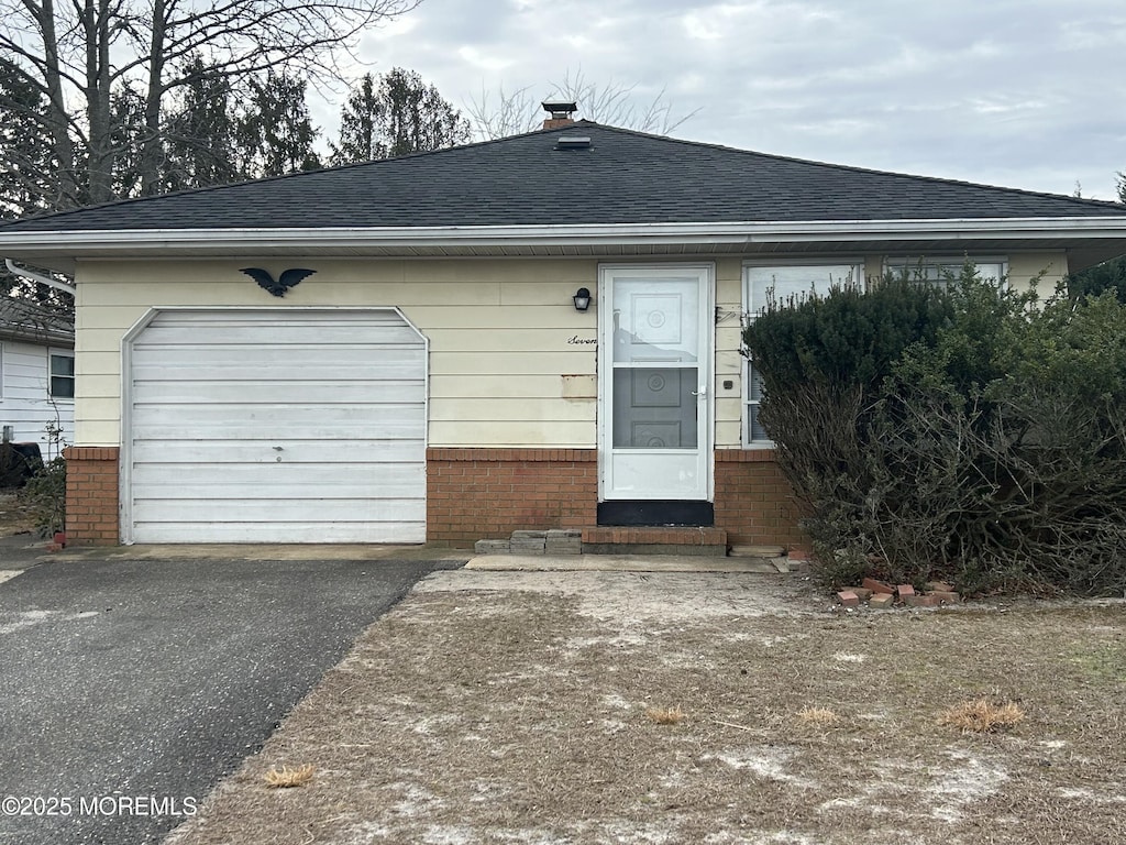 view of front of home with a garage