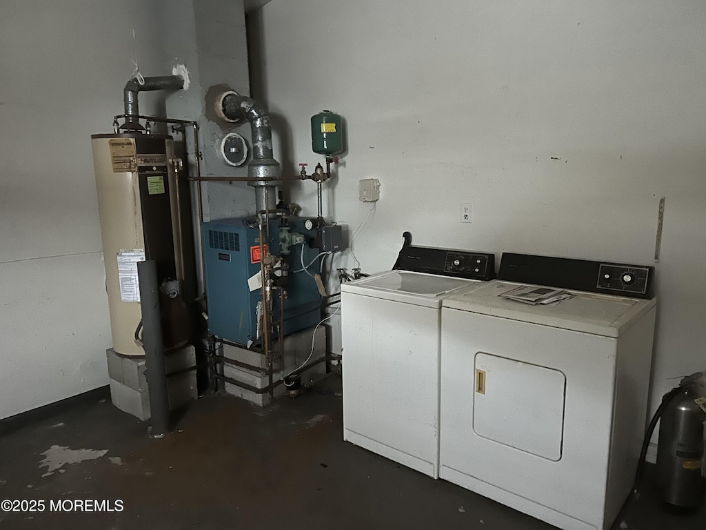 interior space featuring washing machine and clothes dryer and water heater