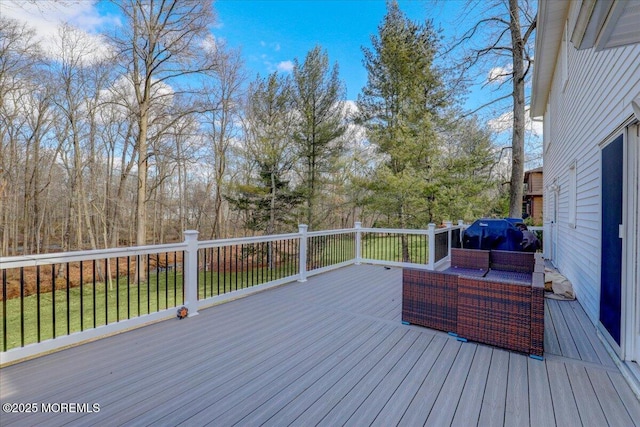 deck with a yard, grilling area, and outdoor lounge area