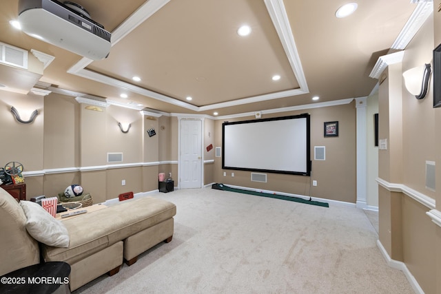 cinema featuring crown molding, recessed lighting, a raised ceiling, and light colored carpet