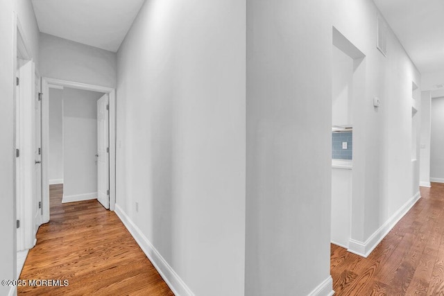 hallway with light wood-type flooring