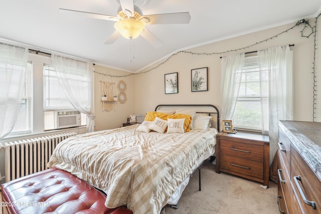 bedroom featuring lofted ceiling, light colored carpet, a ceiling fan, radiator, and crown molding