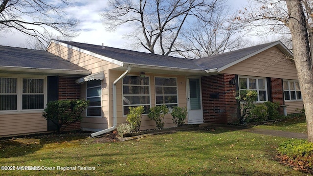 view of front of property with a front lawn