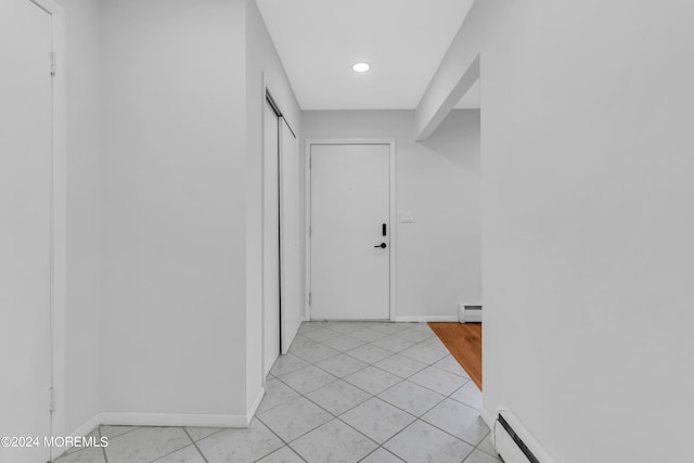 hallway featuring baseboard heating