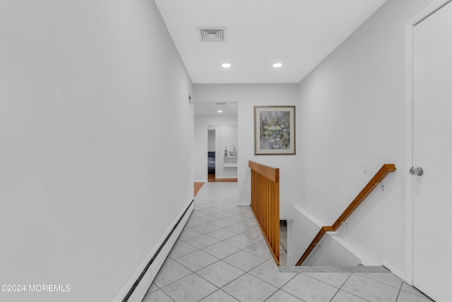 hallway featuring light tile patterned flooring