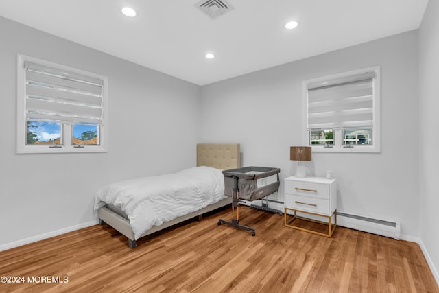 bedroom with light wood-type flooring