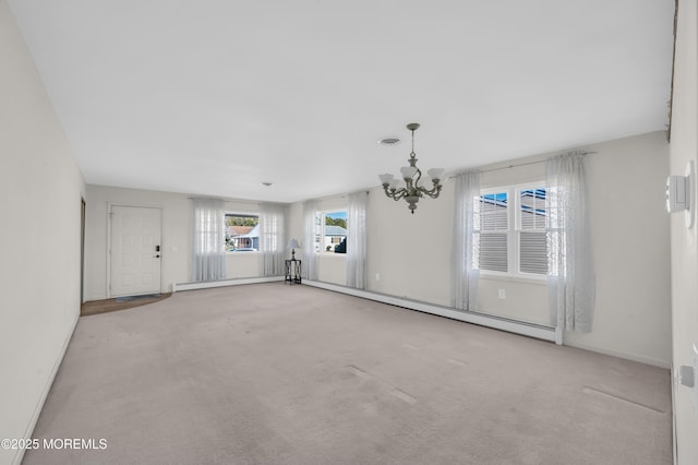 unfurnished living room with a baseboard heating unit, light carpet, visible vents, and baseboard heating