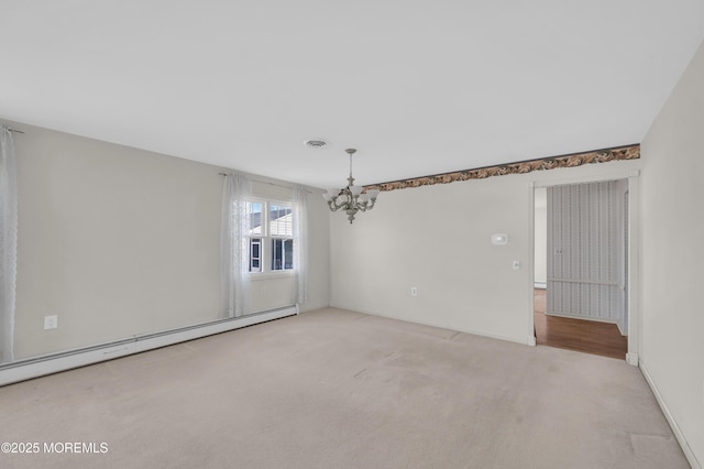 spare room with a notable chandelier, a baseboard radiator, visible vents, light carpet, and baseboards