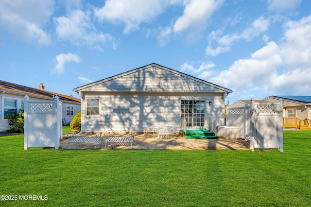 back of house with a yard