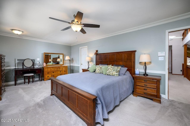 bedroom featuring ornamental molding, light carpet, baseboards, and a ceiling fan