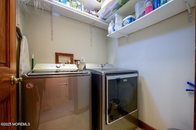 washroom featuring laundry area, independent washer and dryer, and baseboards