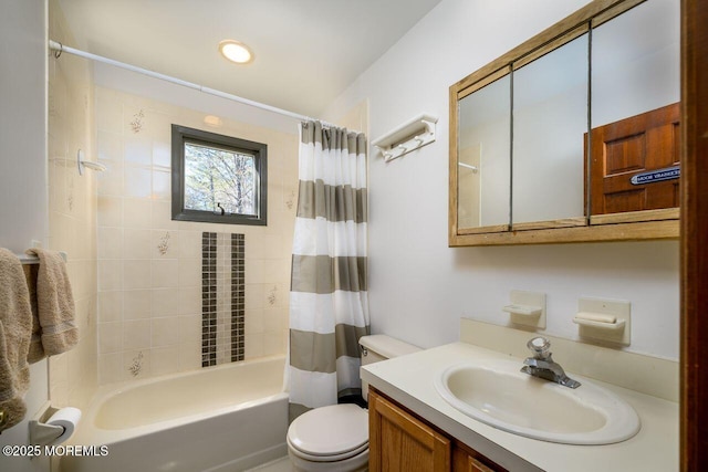 bathroom with shower / bath combination with curtain, vanity, and toilet