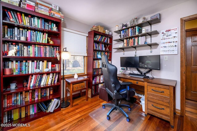 home office with wood finished floors