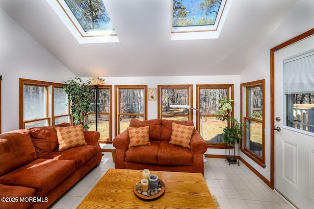 living room with lofted ceiling with skylight, light tile patterned flooring, and a healthy amount of sunlight