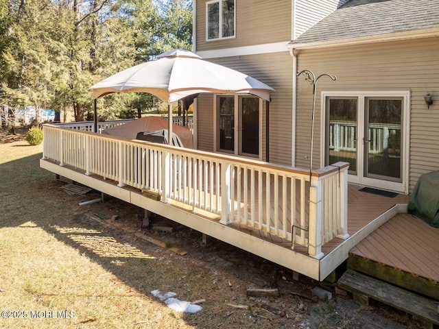 wooden terrace featuring a gazebo