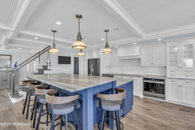 388 Ocean Ave N Unit 6D, Long Branch, NJ 07740 - kitchen with stainless steel appliances, light wood-style floors, white cabinetry, beamed ceiling, and recessed lighting
