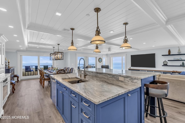 388 Ocean Ave N Unit 6D, Long Branch, NJ 07740 - kitchen with blue cabinets, open floor plan, light wood-type flooring, a breakfast bar area, and recessed lighting