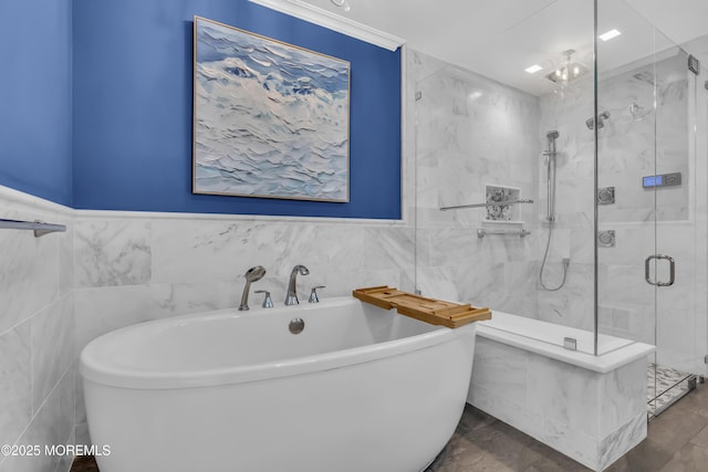 388 Ocean Ave N Unit 6D, Long Branch, NJ 07740 - full bathroom with tile walls, a freestanding bath, a stall shower, and ornamental molding